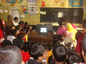 Children are participating the online video conference on the weather project.